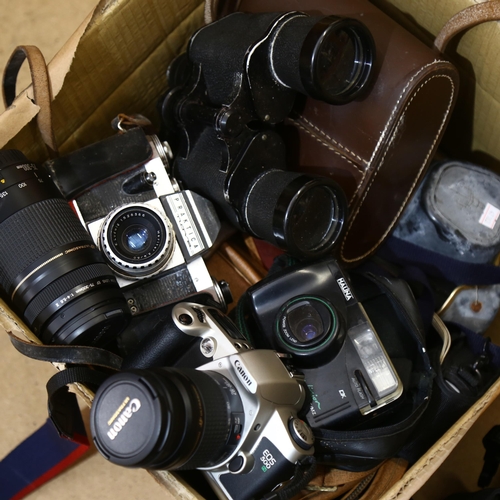 235 - A quantity of Vintage cameras and equipment, including a Canon EOS500N in carry case with additional... 