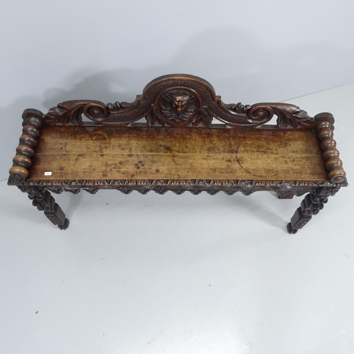 2196 - A 19th century carved oak window seat. 124x74x29cm.