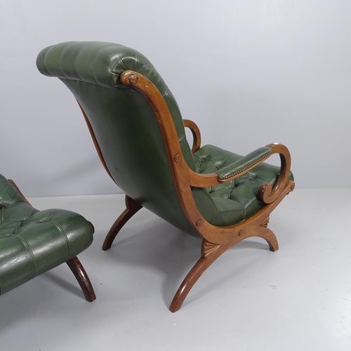 2200 - A green studded leather upholstered armchair, on x-frame legs, with matching ottoman.