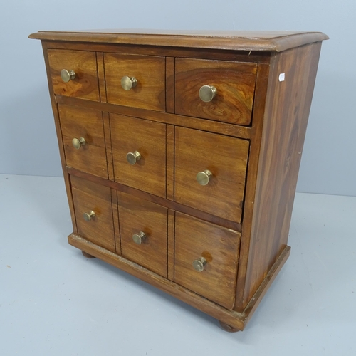 2203 - A modern hard wood chest of three long drawers, with faux fronts and raised on bun feet. 58x65x33cm.