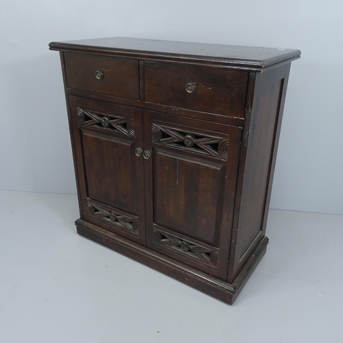 2217 - A 1930s mahogany drinks cabinet, with two drawers above two doors revealing a fitted interior. 85x90... 