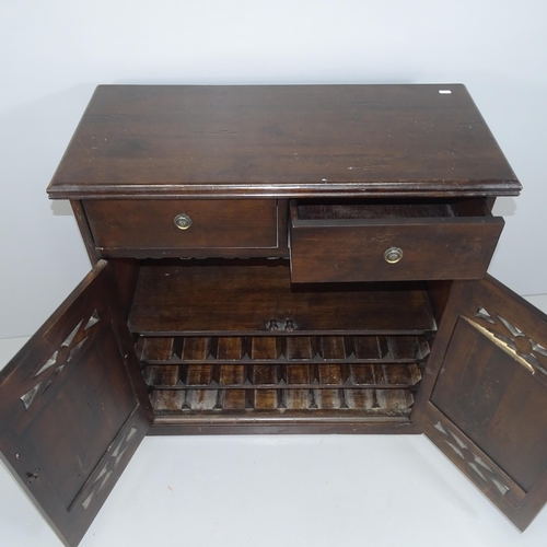 2217 - A 1930s mahogany drinks cabinet, with two drawers above two doors revealing a fitted interior. 85x90... 