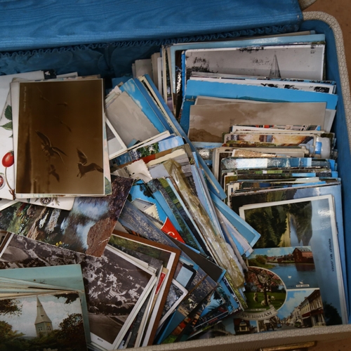 461 - A suitcase containing various Vintage postcards