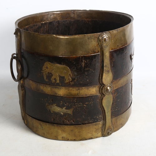 490 - A 19th century Indian wood and brass-bound bucket with ring handles, stylised strapwork and animal d... 