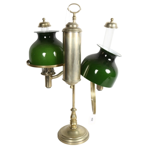 494 - MILLER & SONS PICADILLY - a polished brass double adjustable student's oil lamp, with green glass sh... 