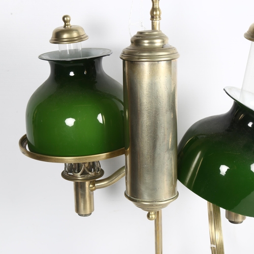 494 - MILLER & SONS PICADILLY - a polished brass double adjustable student's oil lamp, with green glass sh... 