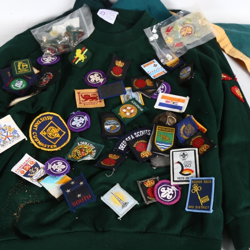 502 - A Cub's uniform, a quantity of Scout's badges, and a small box modelled as a Scout's hat