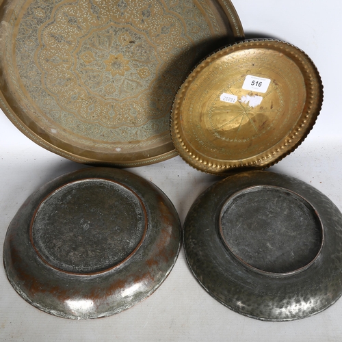 516 - A signed engraved copper dish, and another, and 2 Eastern engraved brass dishes, largest 35cm