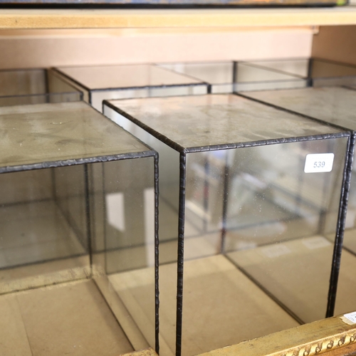 539 - A group of 8 similar glass display cases, with lead frame, H28cm, L29cm, D21cm