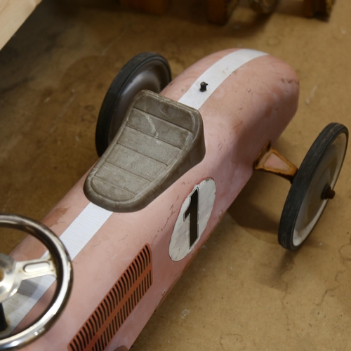 544 - A child's ride-on racing car, manufactured by Kalee Children's Products Company Ltd, L70cm