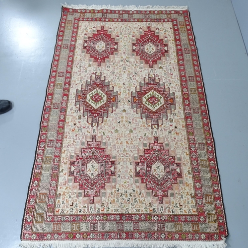 2287 - A cream-ground flat-weave Sumak rug. 205x120cm.