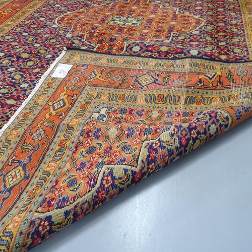 2302 - An orange-ground Bijar carpet. 290x195cm.