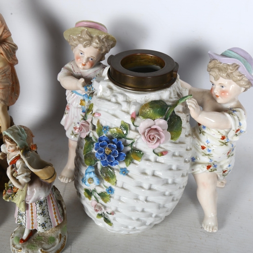 648 - A 19th century porcelain lamp base in the form of children carrying a basket, height 17cm, and 4 oth... 