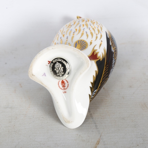 665 - A Royal Crown Derby porcelain puffin paperweight, printed mark in red and silver button, H12cm