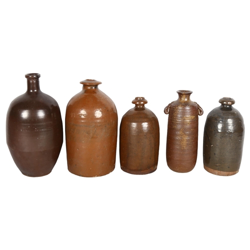 692 - A quantity of 6 Japanese stoneware Sake bottles, largest height 26cm (5)