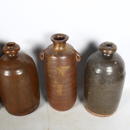 692 - A quantity of 6 Japanese stoneware Sake bottles, largest height 26cm (5)