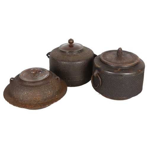 695 - A group of 3 similar Japanese cast-iron cooking pots, largest height 18cm, diameter 22cm