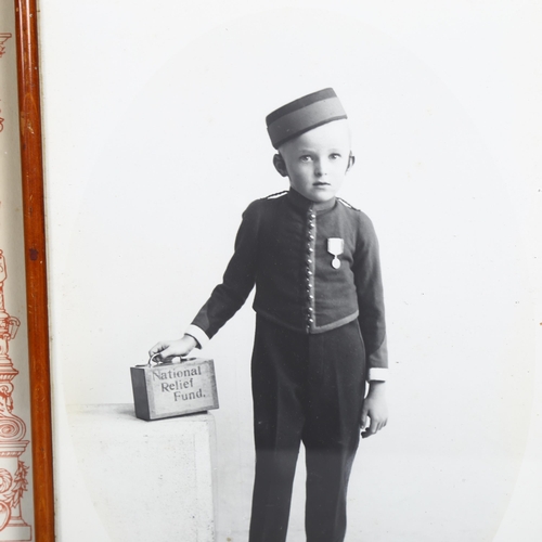 718 - An early 20th century photograph of Kenneth Addison of Hastings, as a child wearing a military badge... 