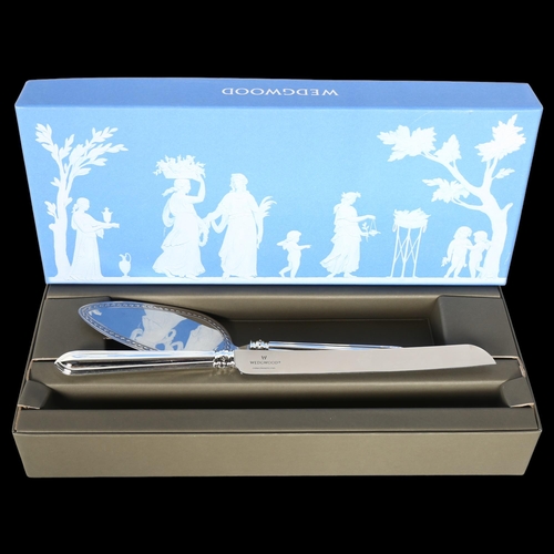 802 - A new and boxed Wedgwood stainless steel cake slice and knife