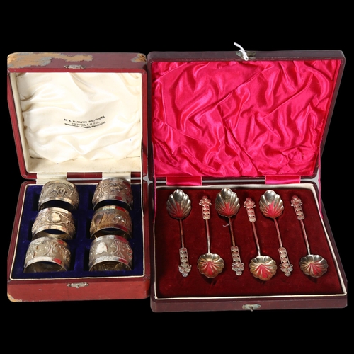 808 - A set of Indian white metal napkin rings, with relief elephant decoration, and a cased set of 6 whit... 