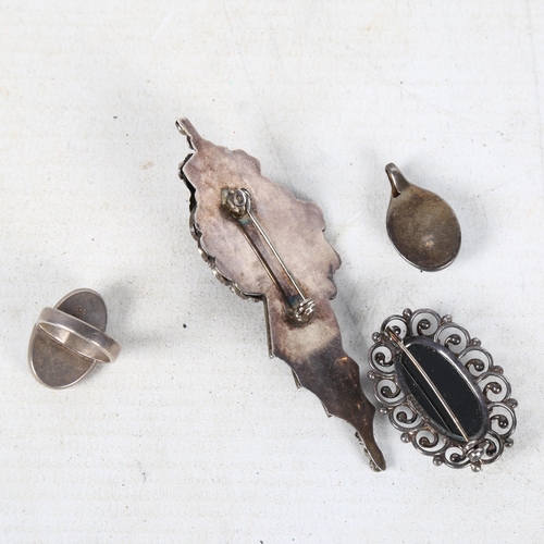 844 - A silver and hematite stone set ring, brooch and pendant, and another