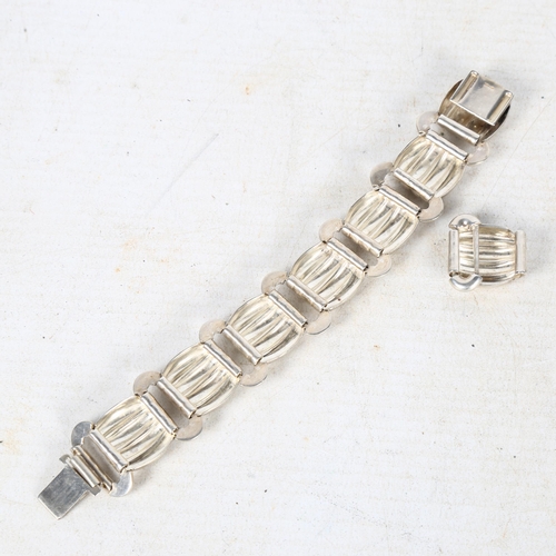 847 - A stylised silver panel bracelet with matching extra link