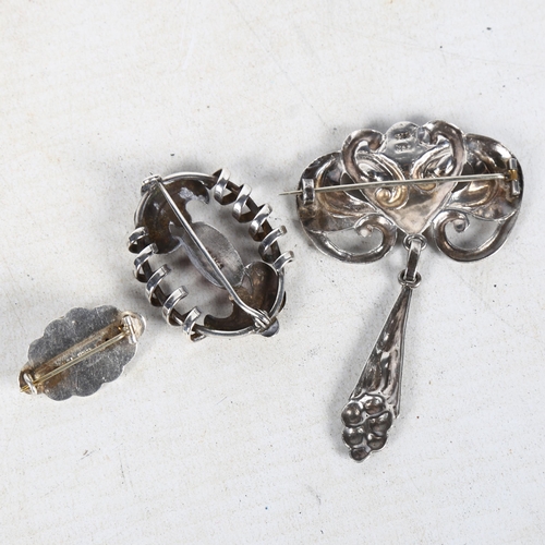 850 - A Danish silver and coral Art Nouveau pendant/brooch, and 2 other silver and coral brooches (3)