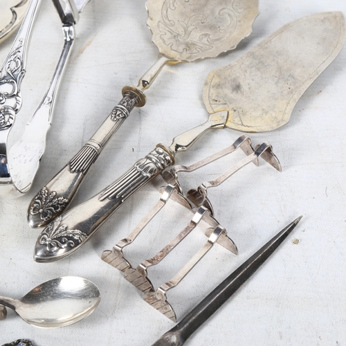 871 - A group of silver items, including a silver dressing table mirror, Russian serving spoons, plated as... 