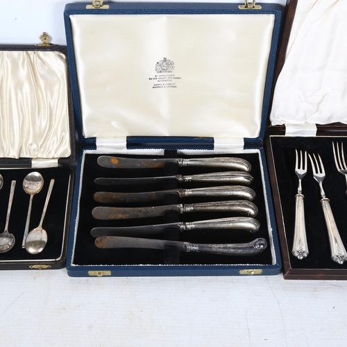 879 - A cased set of silver coffee spoons, silver-handled pastry forks, and a set of 6 pistol grip silver-... 