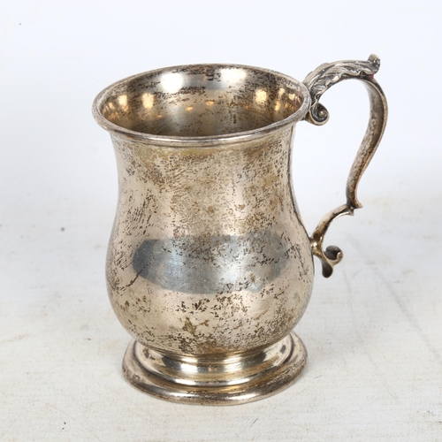 889 - A George V silver christening mug, with leaf design handle, hallmarks for Chester 1911, 4.2oz