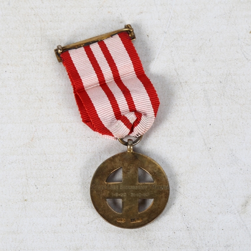 893 - An Elizabeth II silver with red and white enamel medallion, 