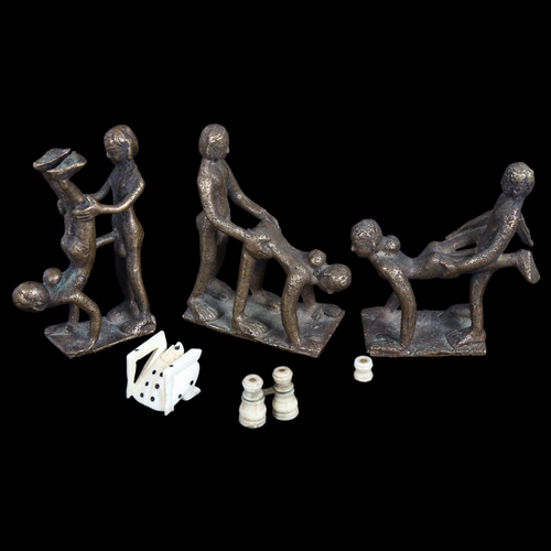 565 - A miniature Stanhope binoculars, and 1 other, made of bone, a bone die, and 3 erotic bronze figurine... 