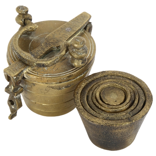 578 - A set of 6 cast-brass resting weights, in cast-brass bucket container