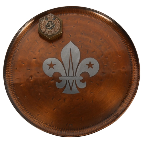 581 - A copper salver with fleur de lis decoration, diameter 28cm, and a Royal Engineers' Military coat of... 