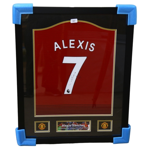 587 - A limited edition framed item of memorabilia Alexis Sanches Manchester United Football Club, signed ... 