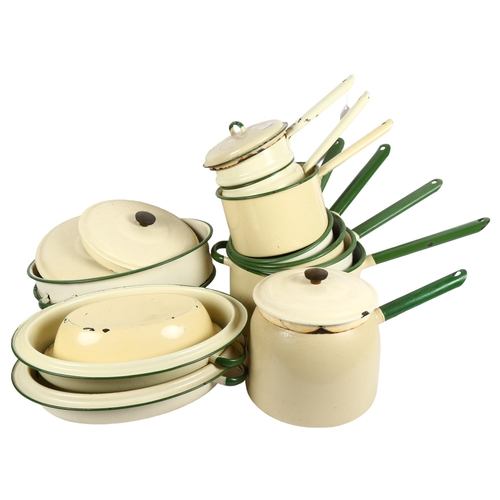 589 - A collection of Vintage cream and green enamelled cookware, including 7 various saucepans, 3 cassero... 