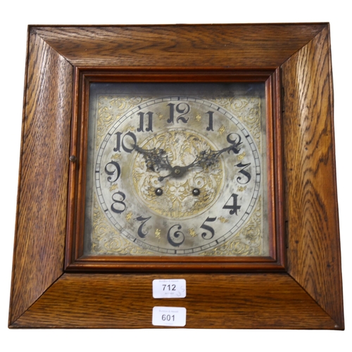 601 - A square oak-cased 2-train wall clock, with engraved dial, 37cm