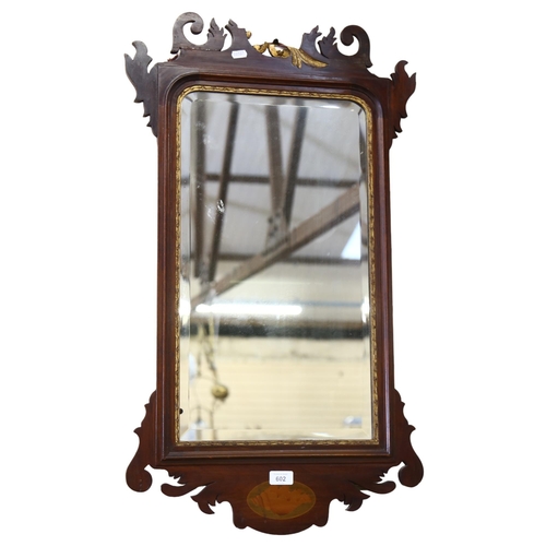 602 - A Georgian design Edwardian wall mirror, with inlaid shell panel and mythical bird finial, H87cm