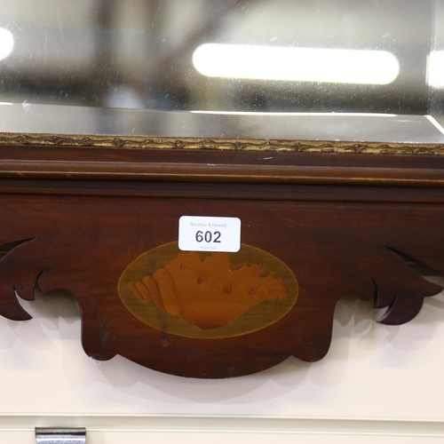 602 - A Georgian design Edwardian wall mirror, with inlaid shell panel and mythical bird finial, H87cm