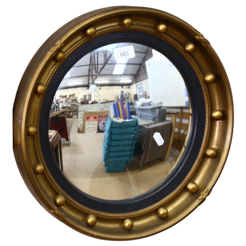 603 - A Vintage convex circular mirror, with ball decorated frame, 41cm