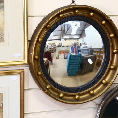 603 - A Vintage convex circular mirror, with ball decorated frame, 41cm