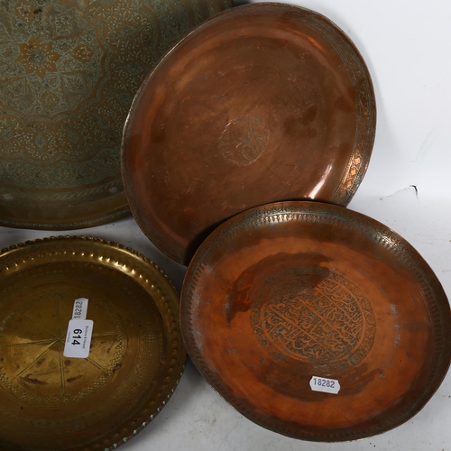 614 - A signed engraved copper dish, and another, and 2 Eastern engraved brass dishes, largest 35cm