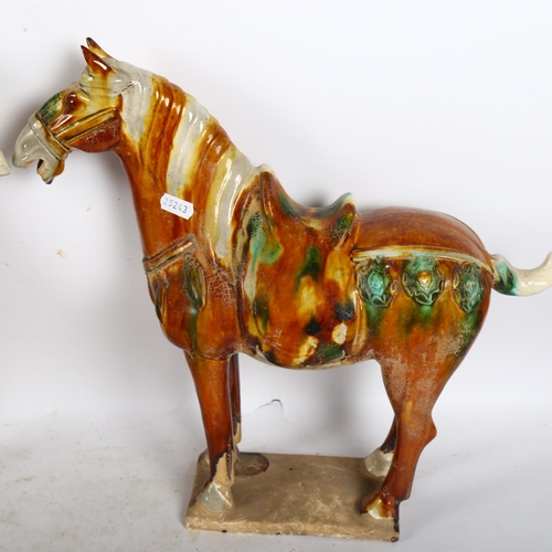 615 - A pair of Tang style glazed pottery horses on plinths, H36cm