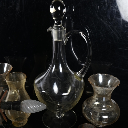 631 - Antique glass wine jug on plinth with stopper, H40cm, a wrought-iron wall light with shade etc