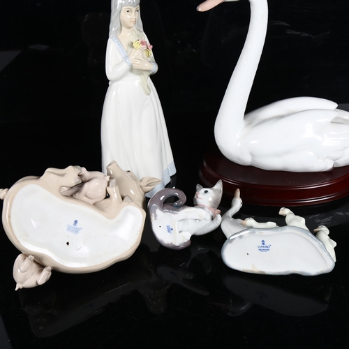 644 - A group of 4 Lladro figures, including swan on plinth, H24cm, a kitten and mouse, and a sow and pigl... 