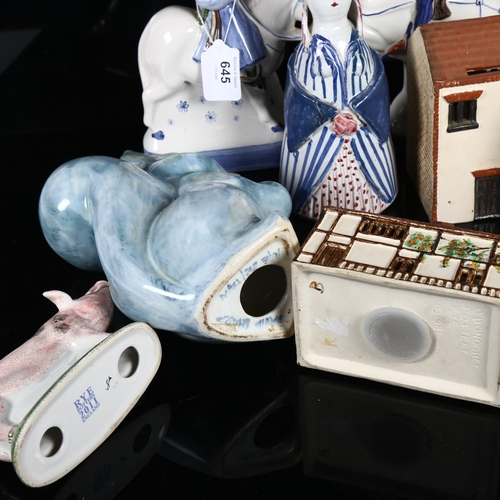 645 - A group of various Rye Pottery, including O'Donoghue cottage money boxes, David Sharp squirrel and b... 