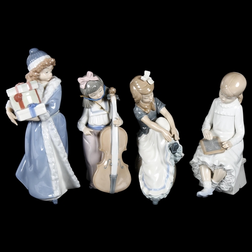 653 - A group of 4 NAO girls, 1 carrying presents, 22cm