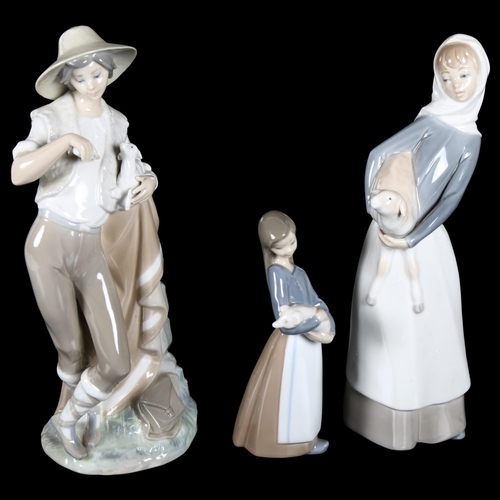 657 - Lladro boy shepherd feeding lamb, 28cm, Lladro girl with sheep, and a smaller Lladro figure with a p... 