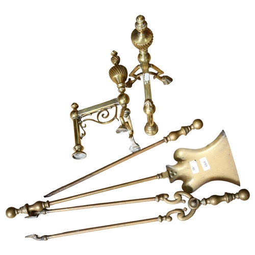 664 - A long-handled 3-piece brass fire companion set, and a pair of andirons