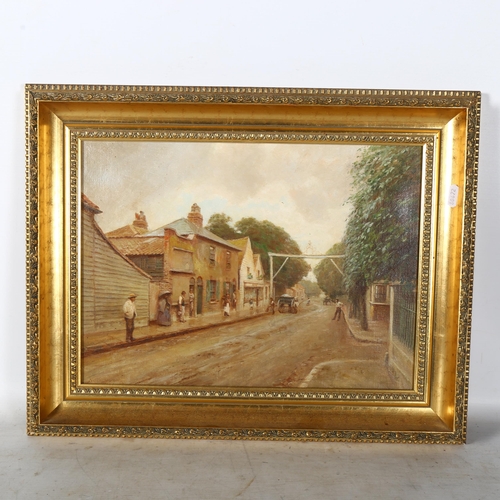 2906 - Oil on canvas, village street scene with figures and horse-drawn carts, indistinctly signed bottom l... 